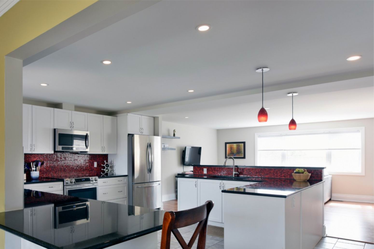 white kitchen red backsplash Amsted Design-Build